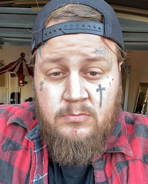 fat guy with face tattoos